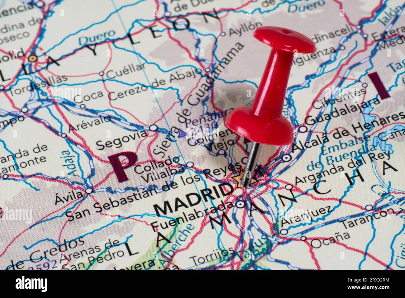 A red push in placed on a map locating Madrid Spain Stock Photo