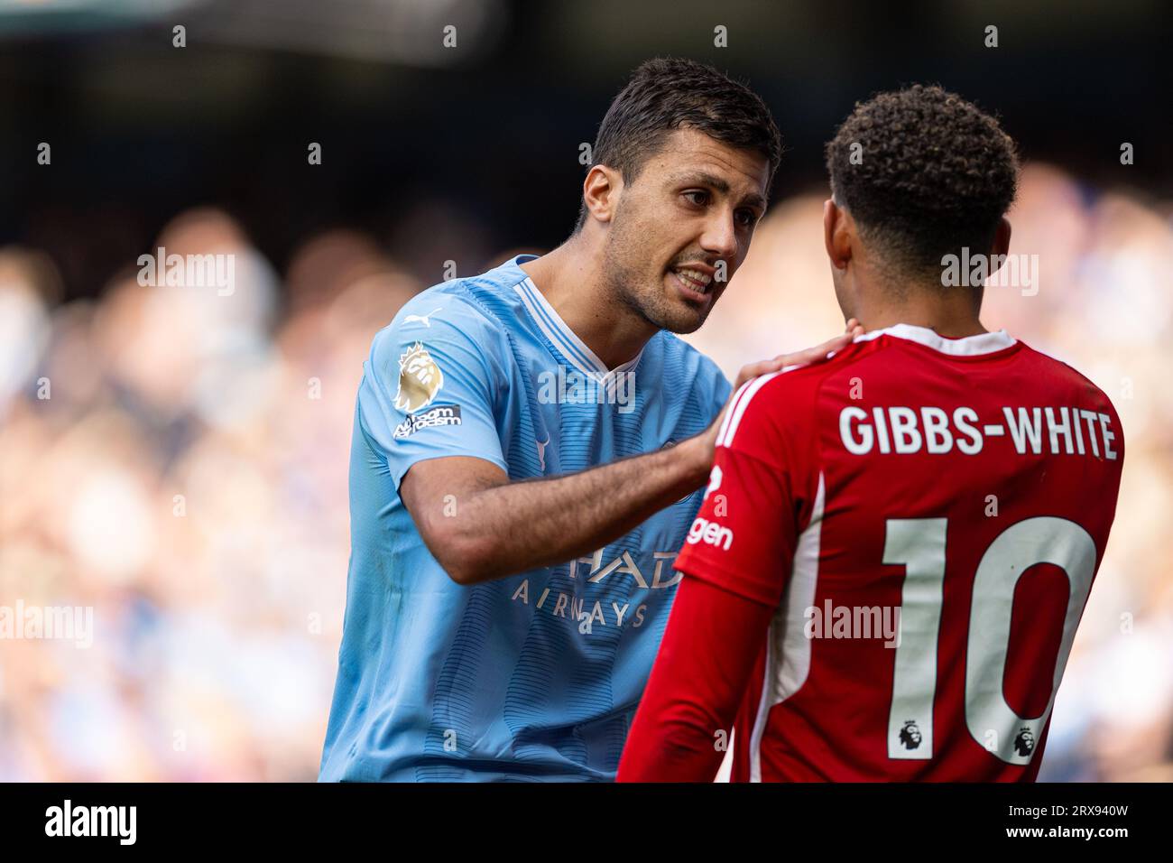 Manchester, UK. 24th Sep, 2023. Manchester City's Rodri (L) talks with Nottingham Forest's Morgan Gibbs-White during the English Premier League match between Manchester City and Nottingham Forest in Manchester, Britain, on Sept. 23, 2023. Credit: Xinhua/Alamy Live News Stock Photo