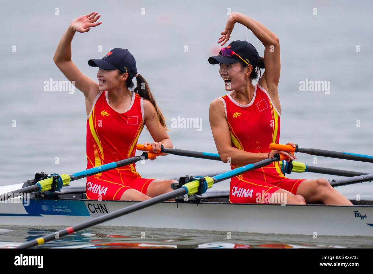 China's Zou Jiaqi, left, and Qiu Xiuping celebrate after winning the ...