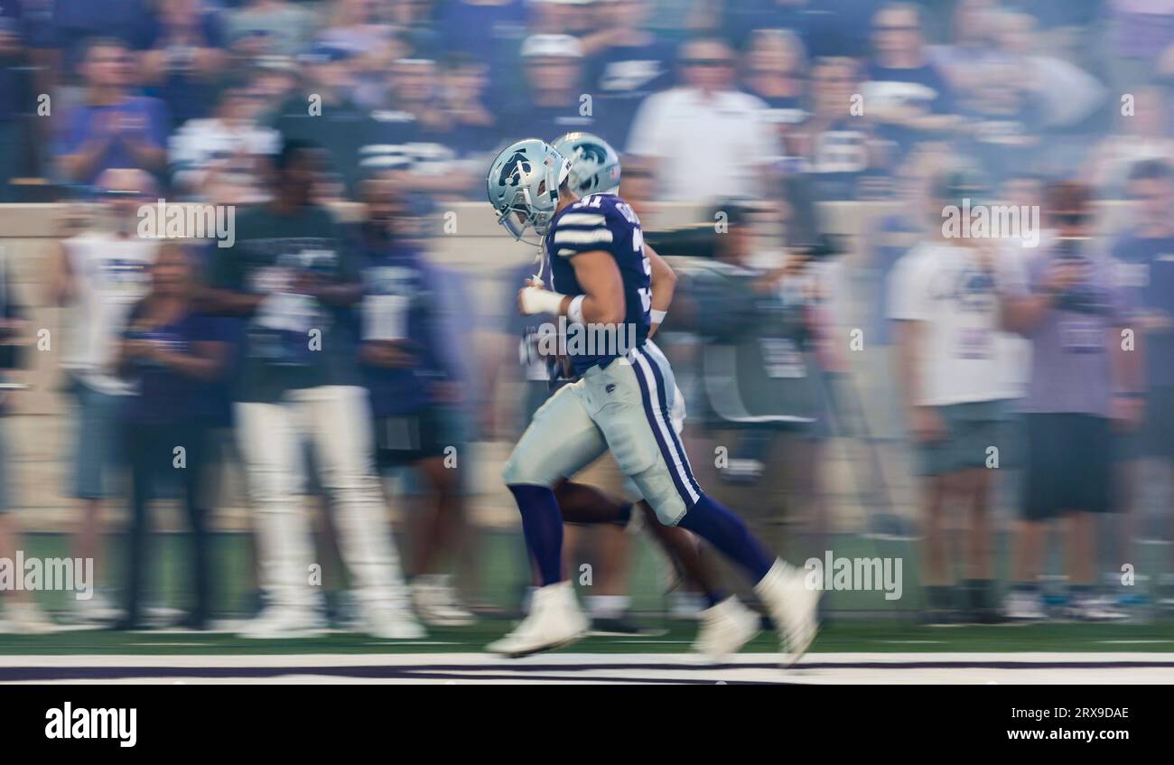 Kansas State linebacker Jake Clifton takes the field through a haze of