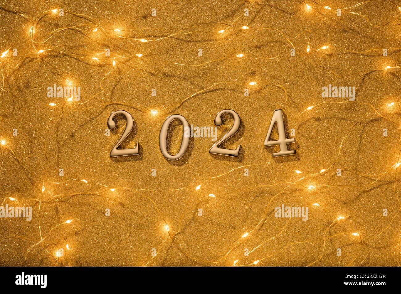 Golden numbers 2024 with Christmas lights on gold glitter texture ...