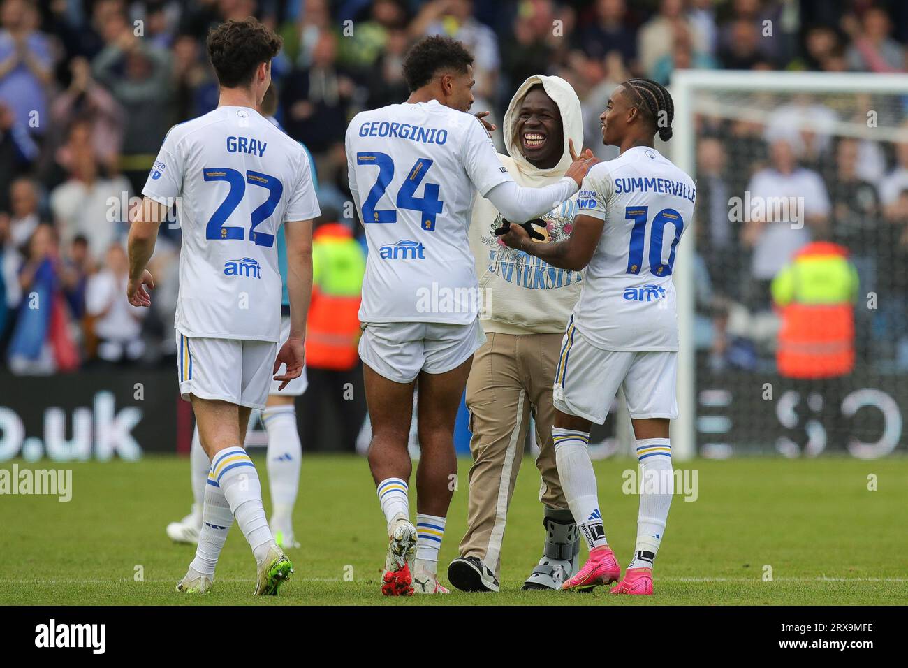 Wilfried Gnonto 29 of Leeds United jokes with his team mates after the