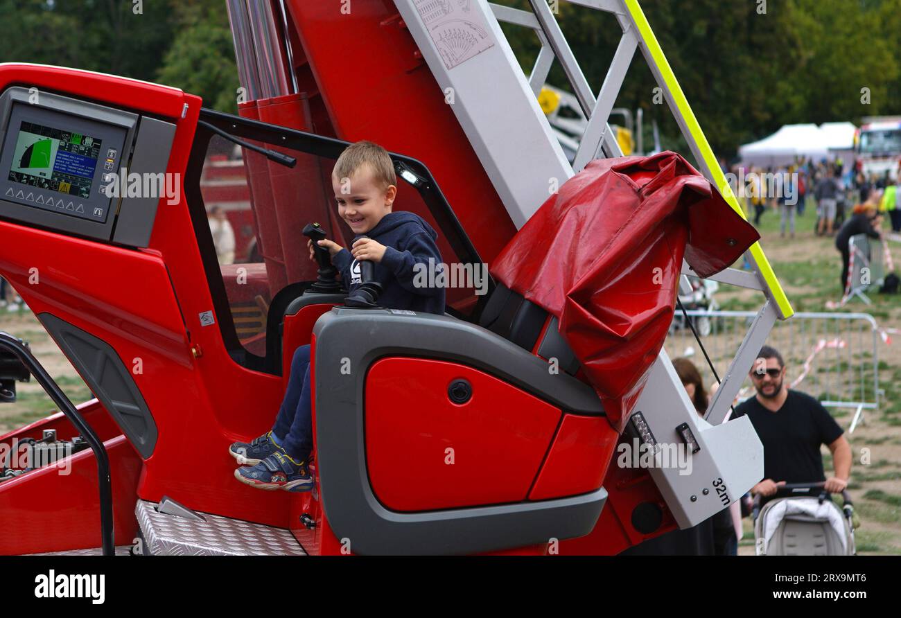 Prague, Czech Republic. 23rd Sep, 2023. A boy tries to operate a crane during the Heroes' Day event in Prague, the Czech Republic, on Sept. 23, 2023. The annual event, which showcases the work of the integrated rescue services in the Czech Republic via exhibits and hands-on activities, took place at the Prague Exhibition Grounds on Saturday. Credit: Dana Kesnerova/Xinhua/Alamy Live News Stock Photo