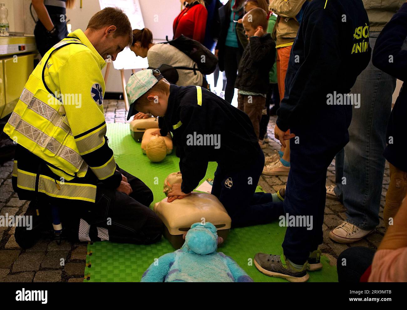 Prague, Czech Republic. 23rd Sep, 2023. A boy tries cardiac resuscitation during the Heroes' Day event in Prague, the Czech Republic, on Sept. 23, 2023. The annual event, which showcases the work of the integrated rescue services in the Czech Republic via exhibits and hands-on activities, took place at the Prague Exhibition Grounds on Saturday. Credit: Dana Kesnerova/Xinhua/Alamy Live News Stock Photo