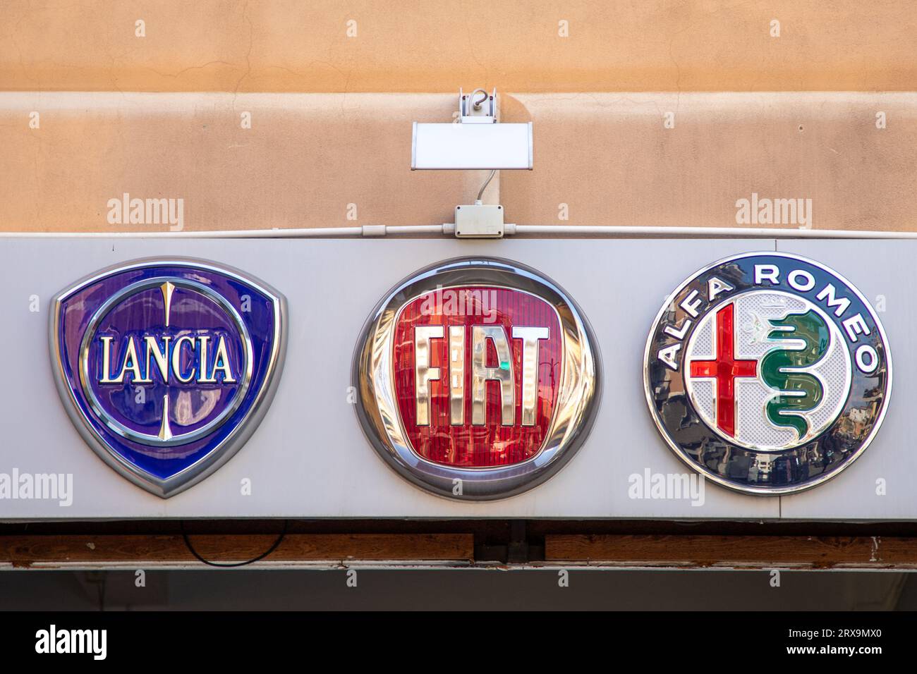 Milan, Italy 09 18 2023 Fiat logo Alfa Romeo sign and text lancia