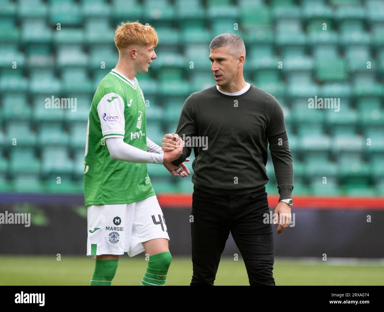 Edinburgh, UK. 23rd Sep, 2023. Scottish Premiership - Hibernian FC v St Johnstone FC 23/09/2023 Hibs' new Head Coach, Nick Montgomery, congratulates midfielder, Rory Whittaker, who, when he came on in the 70th minute became the youngest player ever to have played for the club salute the crowd after beating St Johnstone 2-0 thanks to goals by Lewis Miller and Dylan Vente in the Scottish Premiership at Easter Road Stadium, Edinburgh, UK Credit: Ian Jacobs/Alamy Live News Stock Photo