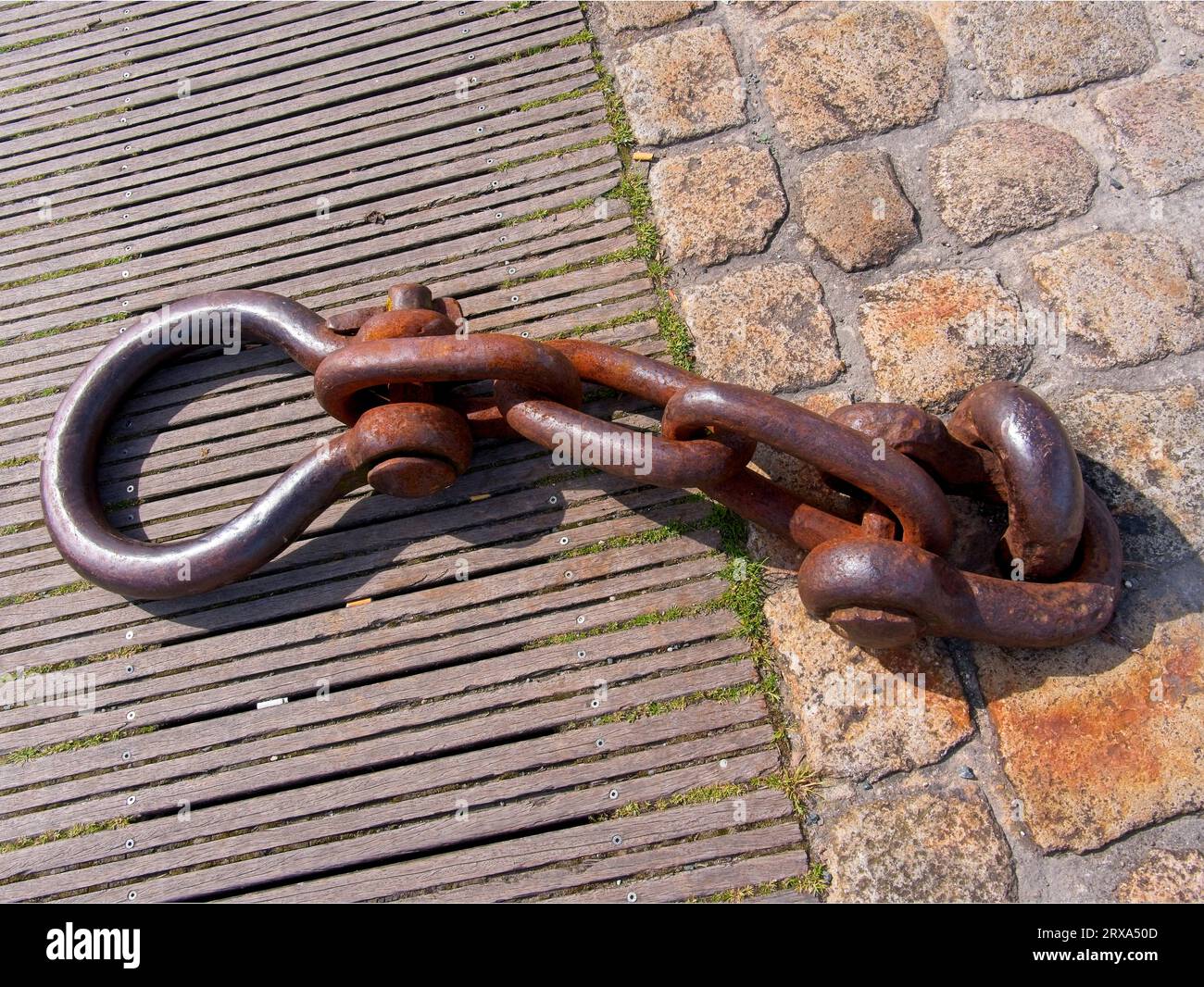 Rusty ships mooring ring set in the harbourside pavement, La Rochelle ...