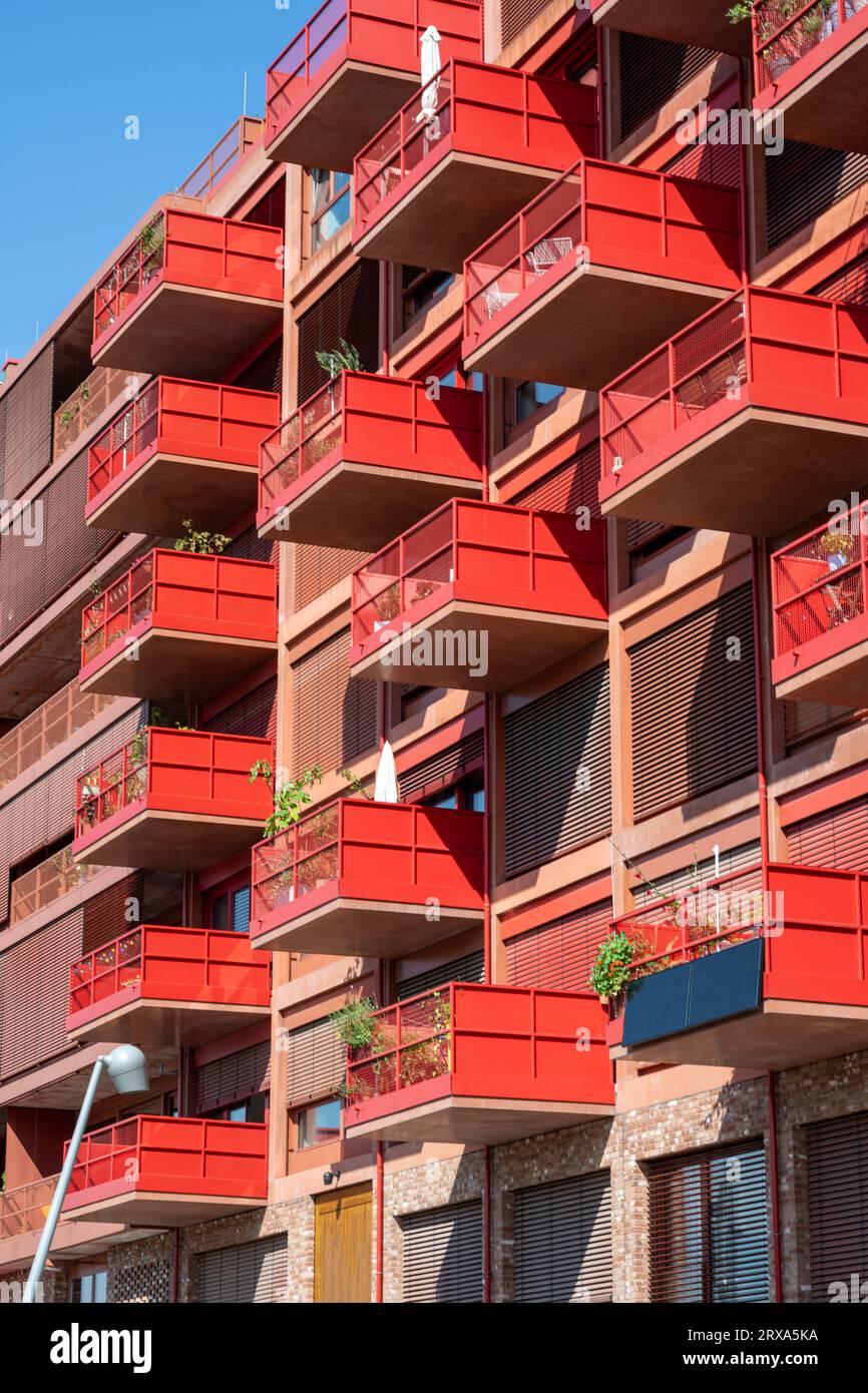 Red apartment building with big balconies seen in Berlin, Germany Stock