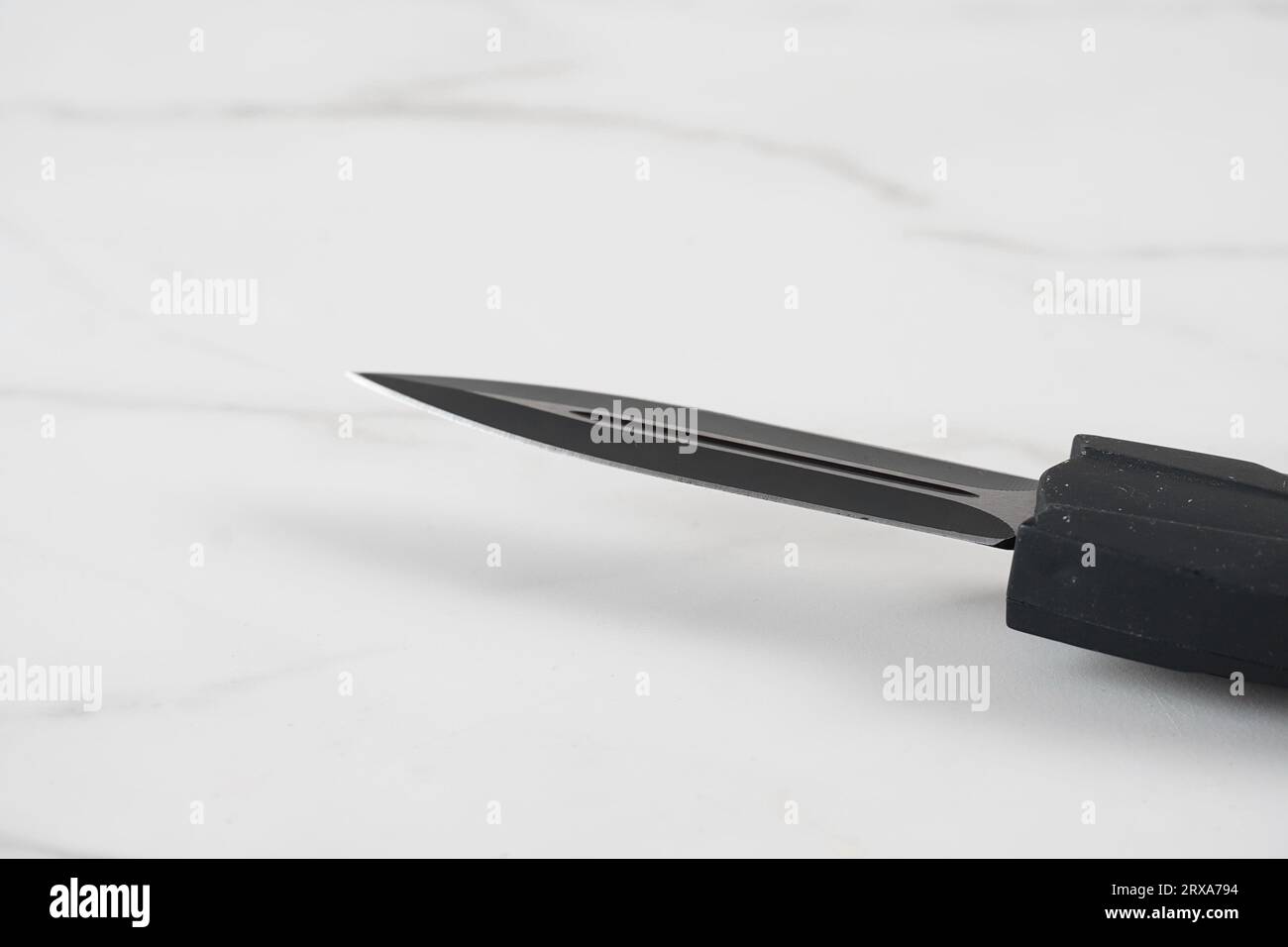 Switchblade (automatic) outthefront (OTF) knife with black handle and