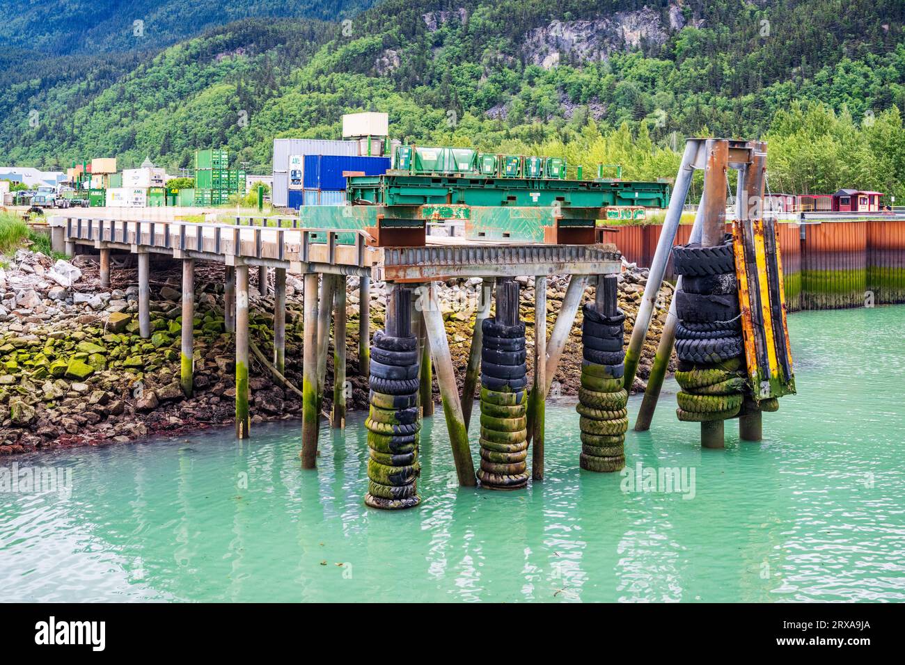 Service dock adjacent to Alaska Marine Lines freight and container yard at the Port of Skagway, Alaska, USA. Stock Photo