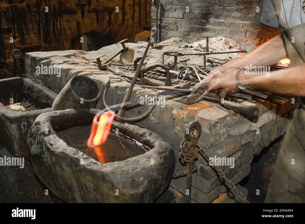 Ferron working in the forge of the El Pobal ironworks Stock Photo