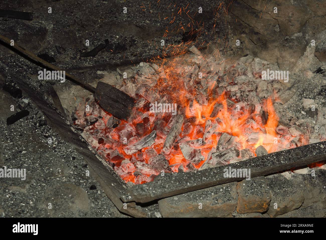 Detail of the preparation of the fire in the El Pobal ironworks Stock Photo