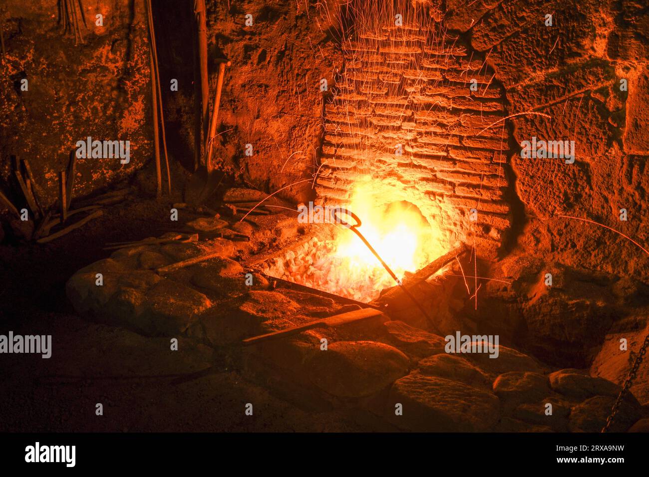 Detail of the preparation of the fire in the El Pobal ironworks Stock Photo