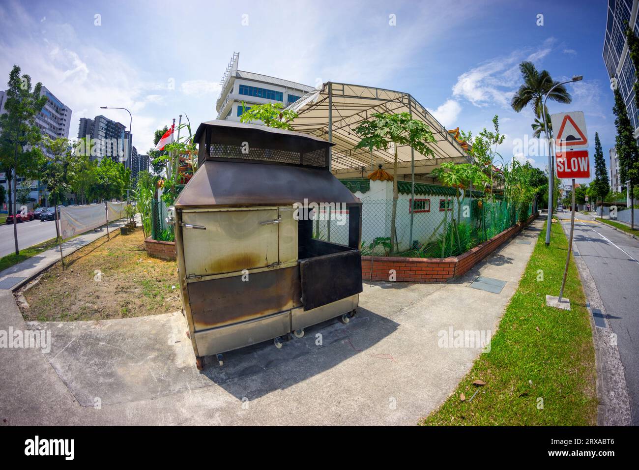 A rubbish burner for public use on footpath in Geylang district, Singapore Stock Photo