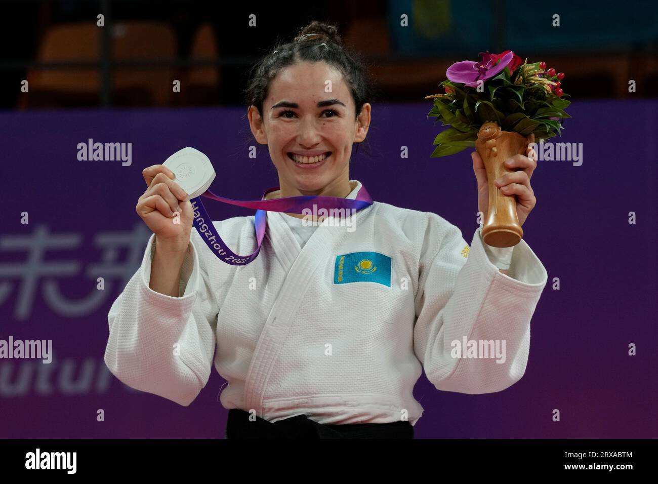 Kazakhstan's Abiba Abuzhakynova celebrates with her silver medal in the