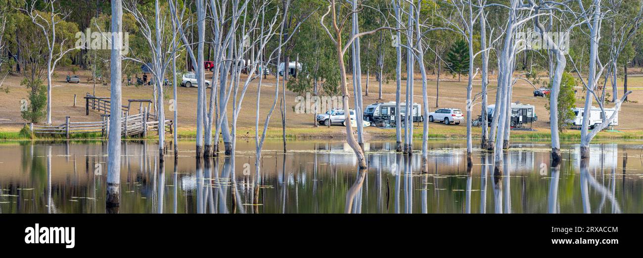 Caravans camping on backs of freshwater dam, Childers, Queensland Australia Stock Photo