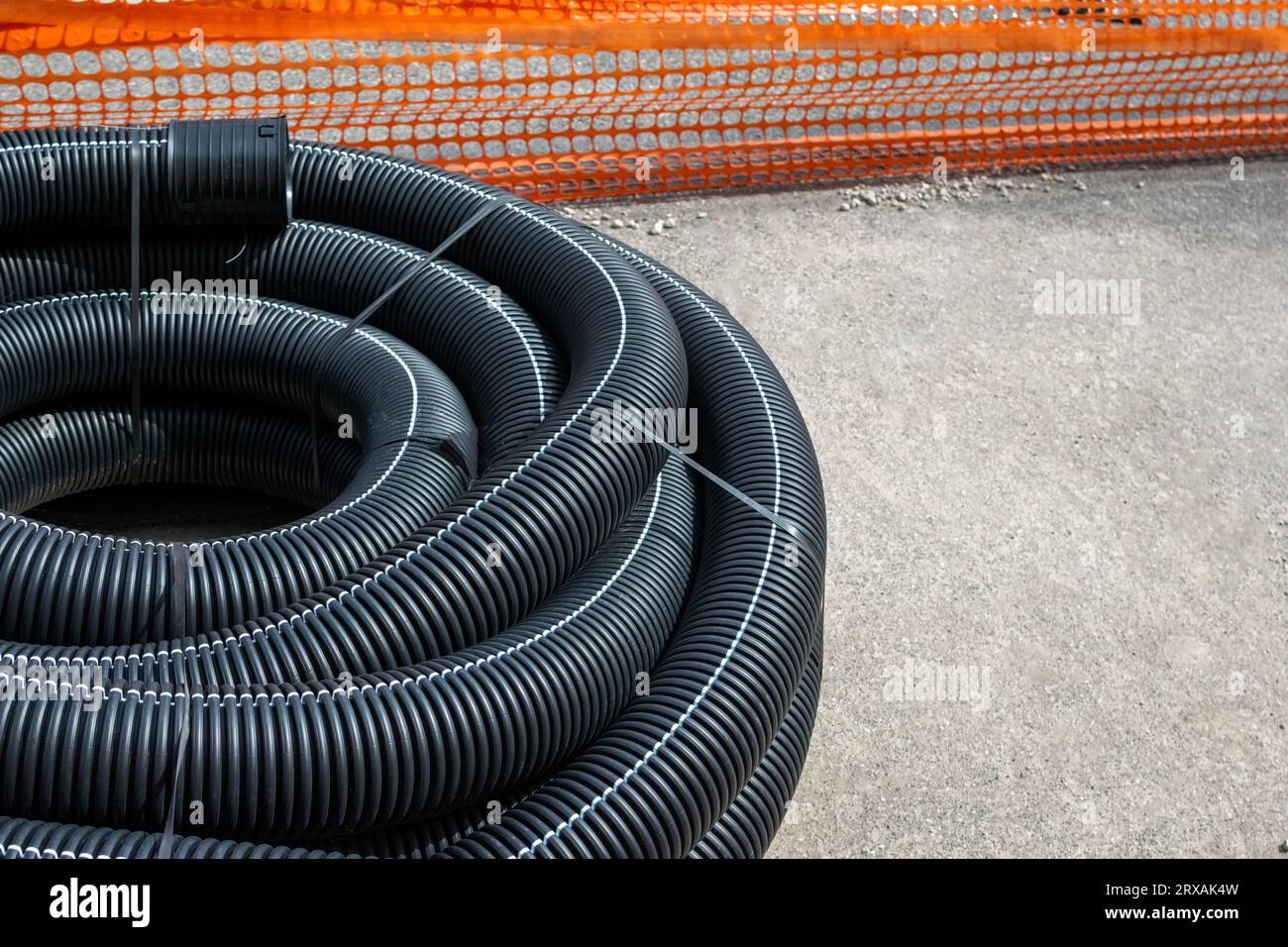 Long plastic tubes in works area for remodeling subsoil for electrical systems Stock Photo