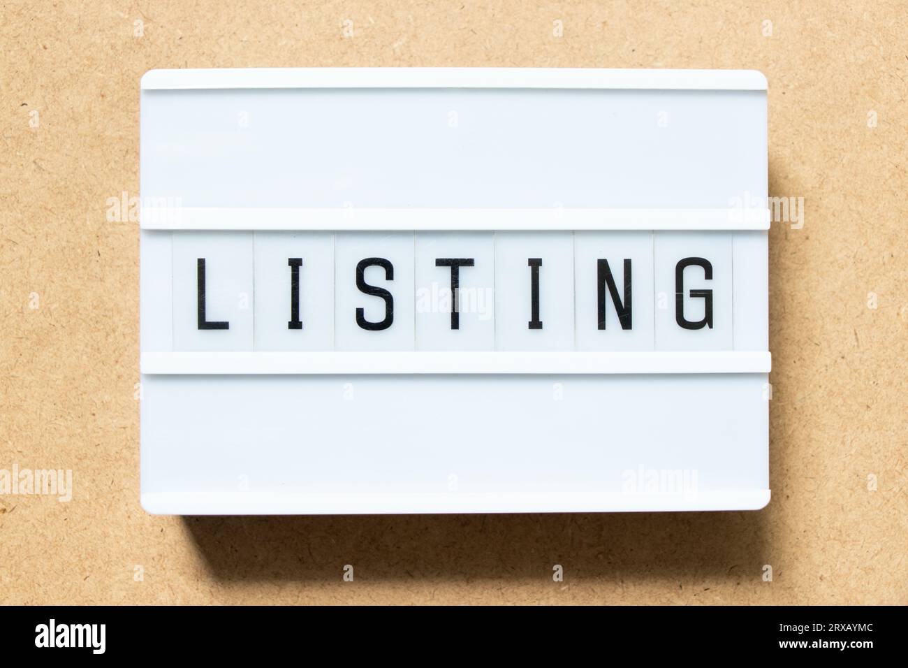 Lightbox with word listing on wood background Stock Photo