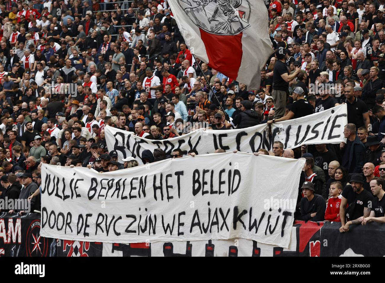 AMSTERDAM - Ajax fans with banners 'RCK draw your conclusion' and 'You