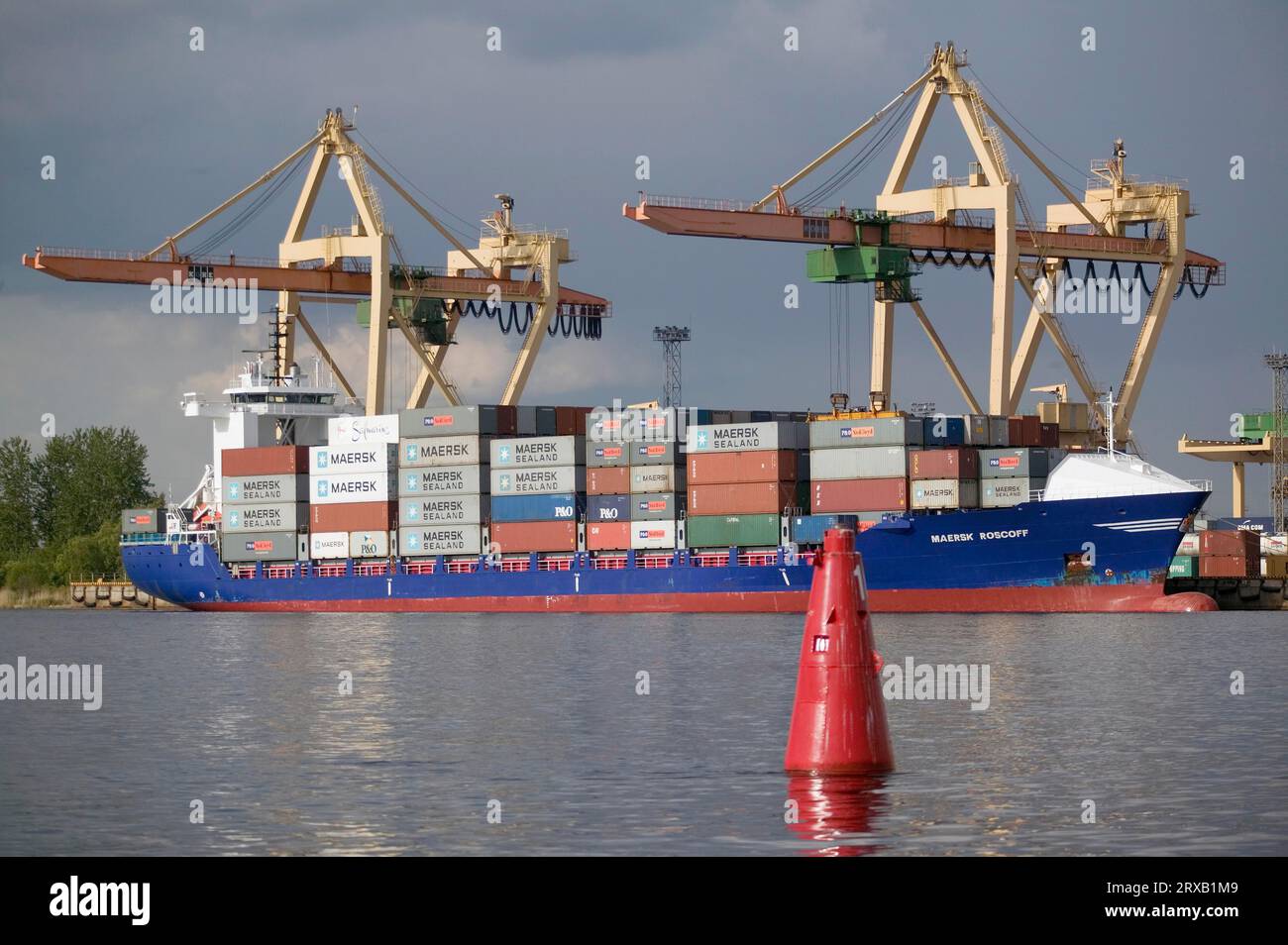 Container ship loading at the container terminal in Riga Stock Photo ...
