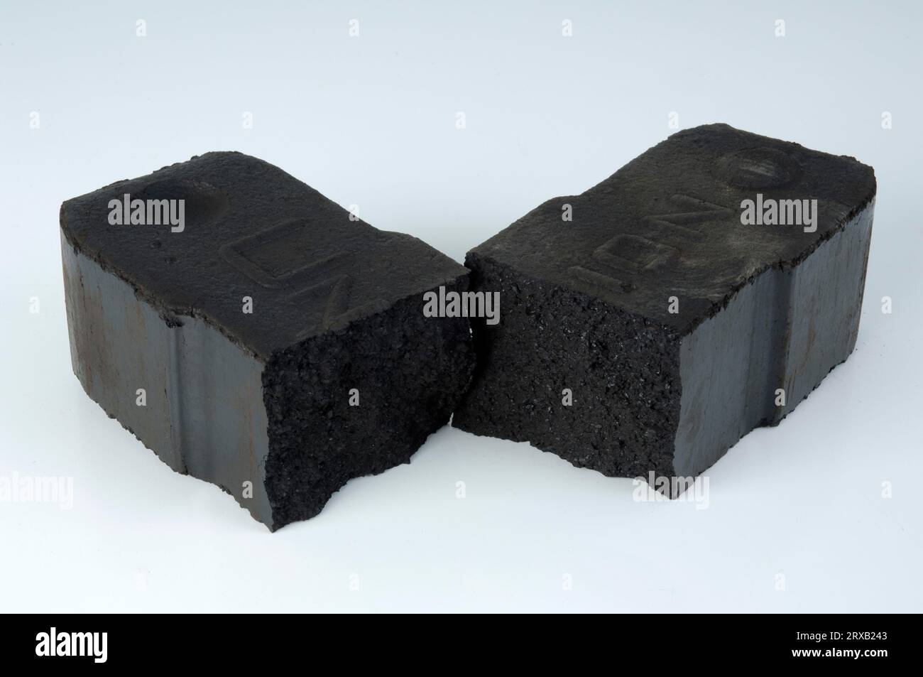 tower of lignite briquettes with two single bricks in front, white  background, isolated, copy space Stock Photo - Alamy