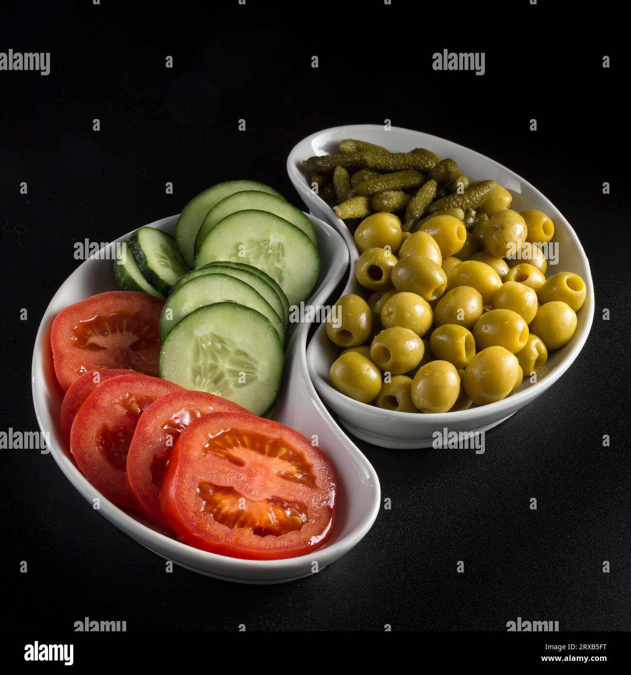 kidneyshaped appetizer trays, placed next to each other making a set