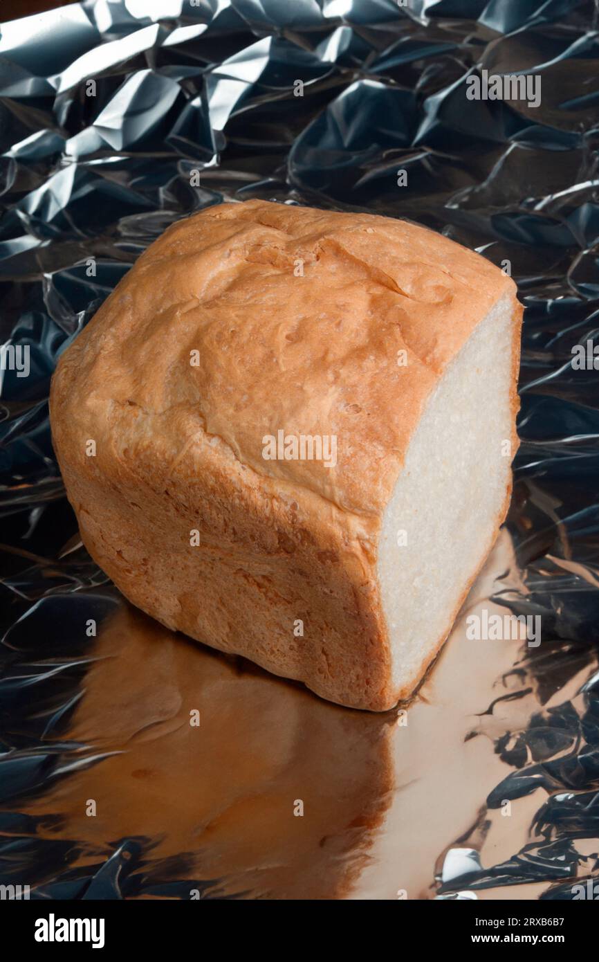 Home baked loaf on a sheet of kitchen foil Stock Photo