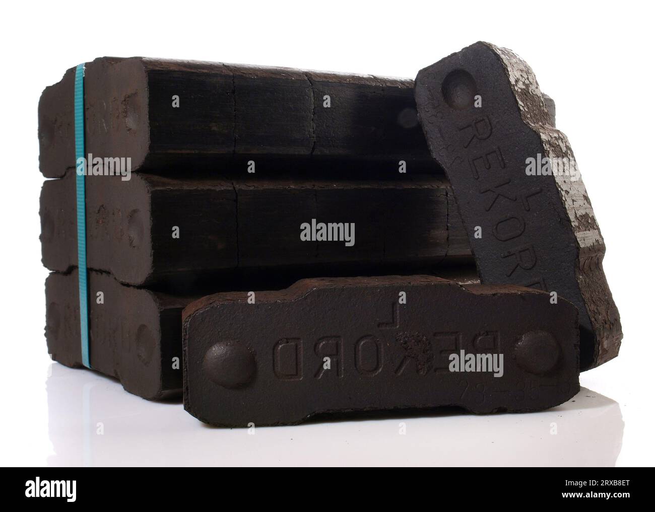 Coal Briquettes Bundle isolated on white Background Stock Photo