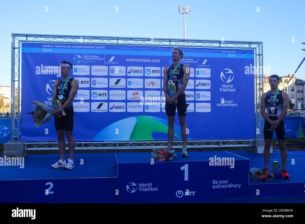 Pontevedra, Spain. 23rd Sep, 2023. The Championship podium with Domian Coninx, Hayden Wilde (L) and Léo Bergere (R) during the 2023 Elite Men's Triathlon World Championship, on September 23, 2023, in Pontevedra, Spain. (Photo by Alberto Brevers/Pacific Press) Credit: Pacific Press Media Production Corp./Alamy Live News Stock Photo