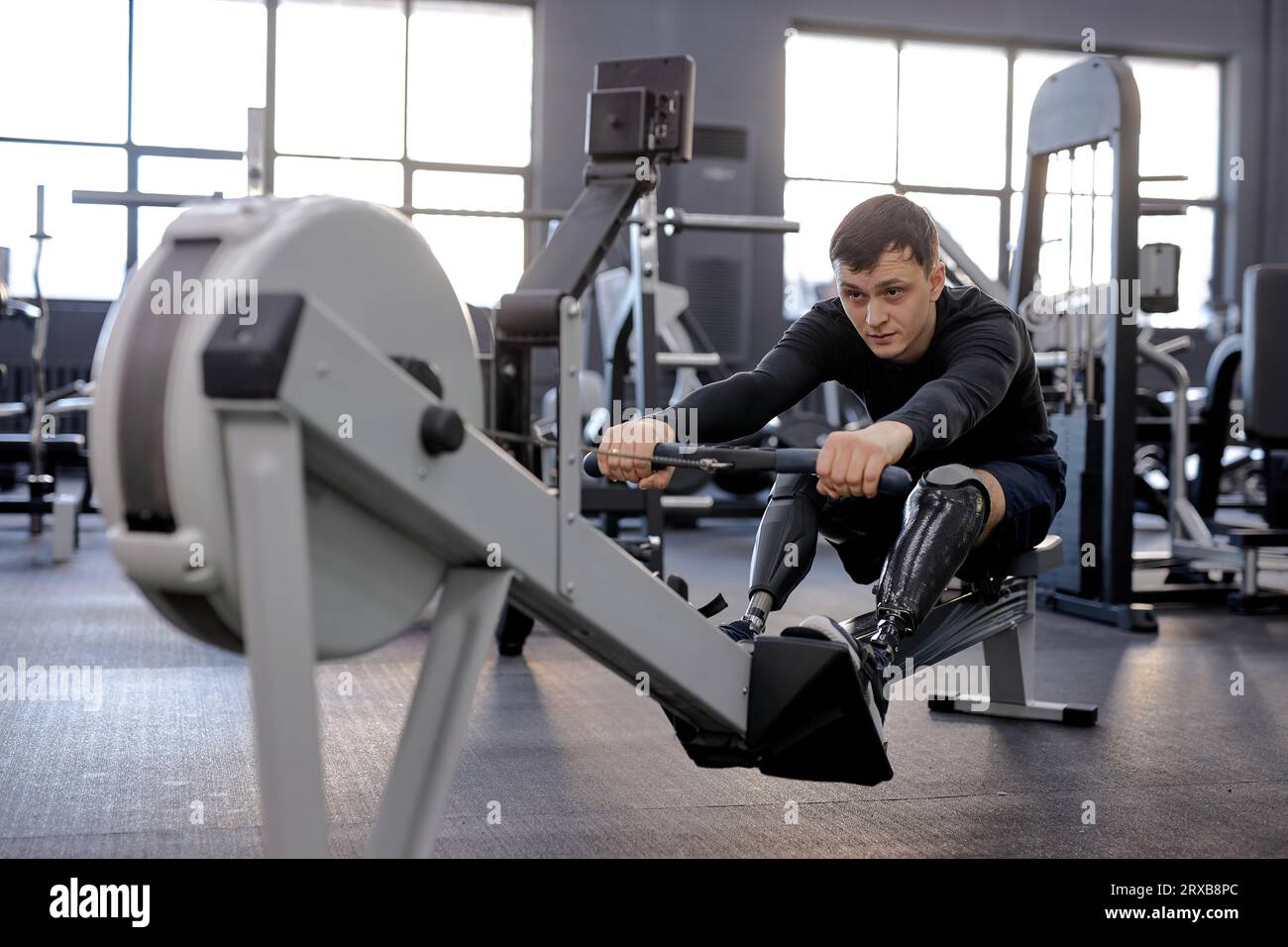 love of life. hardworking young man in stylish sportswear performs cardio workout Stock Photo