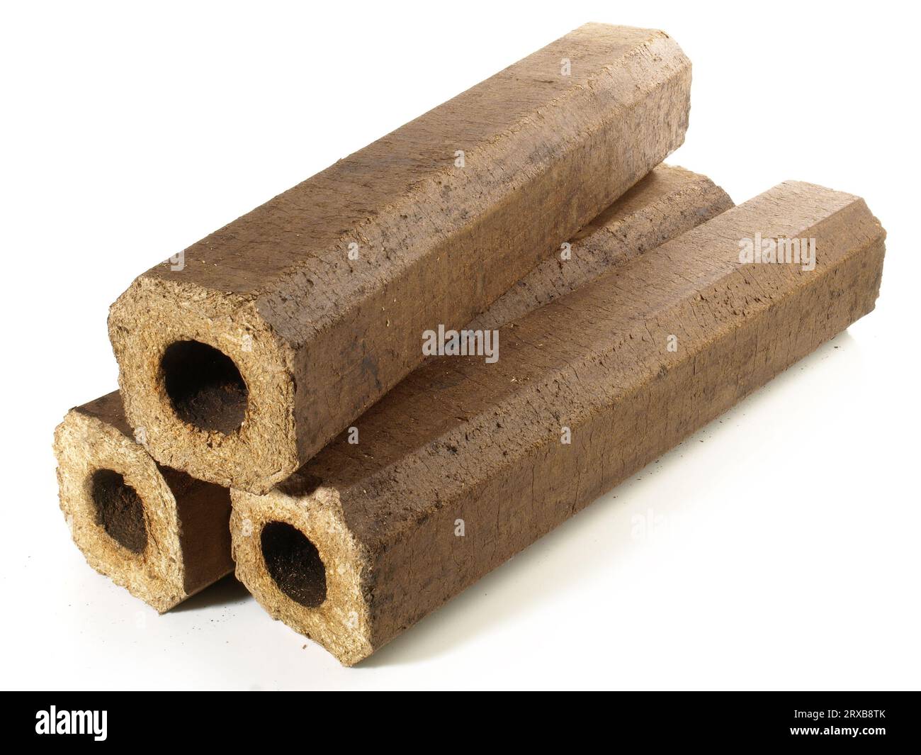 Hollow Hardwood Sawdust Briquettes - Compressed Biomass Wood Fire Logs isolated on white Background Stock Photo