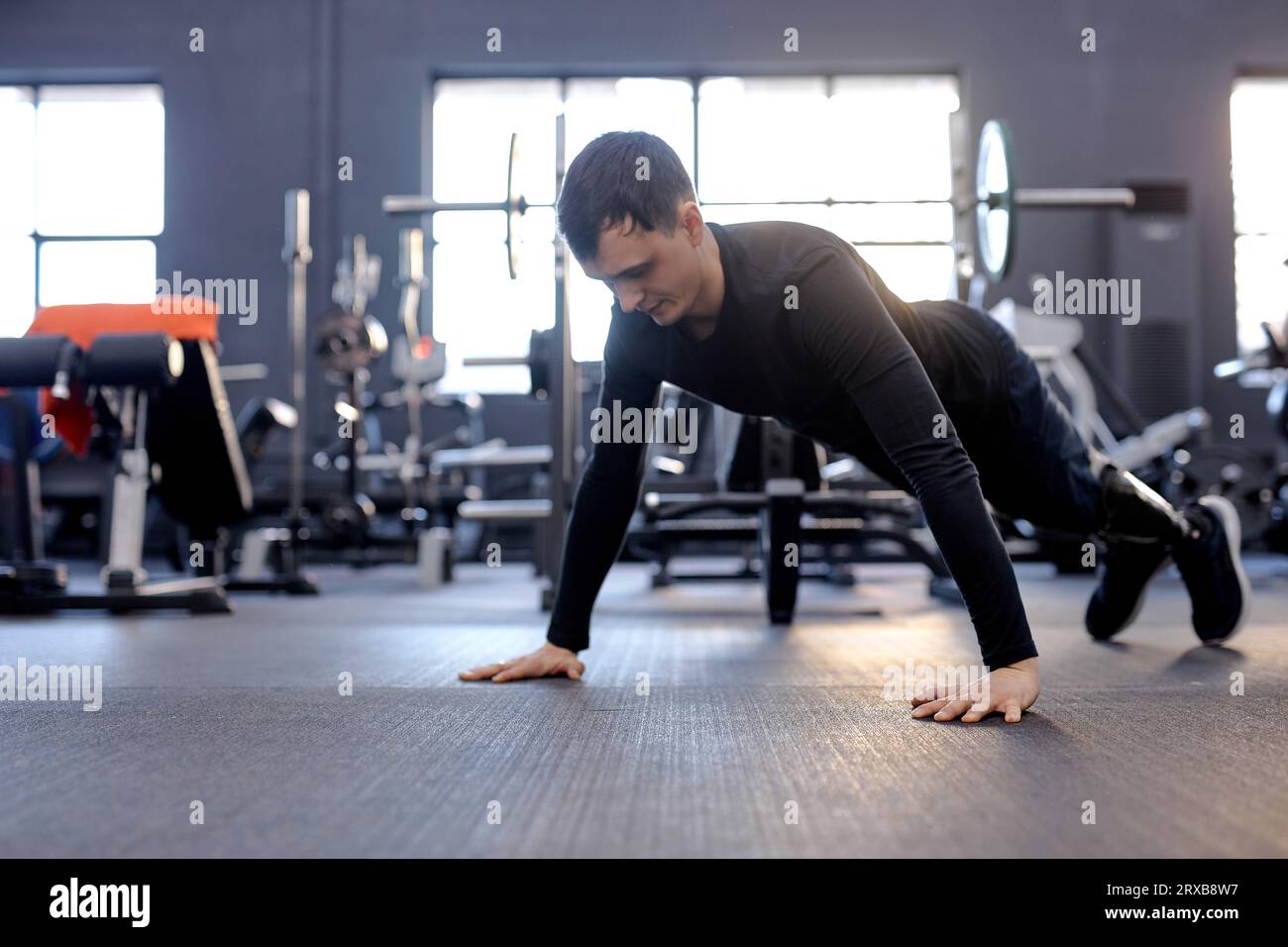 love of life. cross fit. active strong man performing push-up on the floor. hobby, free time, spare time, health and body care Stock Photo