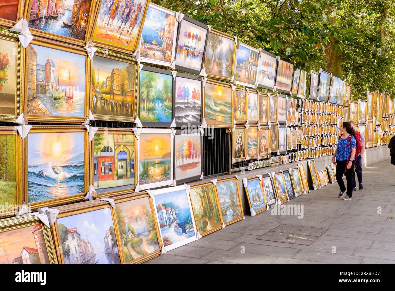 Paintings hung on the railings of The Green Park at Piccadilly Art Market, London, UK Stock