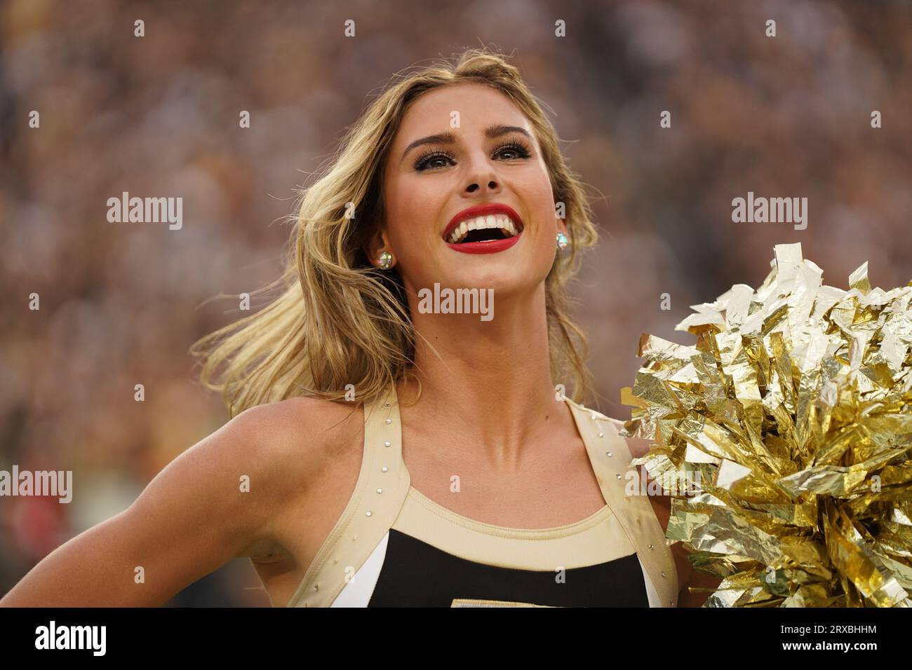 West Lafayette, IN USA; A Purdue Boilermakers cheerleader entertains the fans during an NCAA football game against the Wisconsin Badgers, Friday, Sept Stock Photo