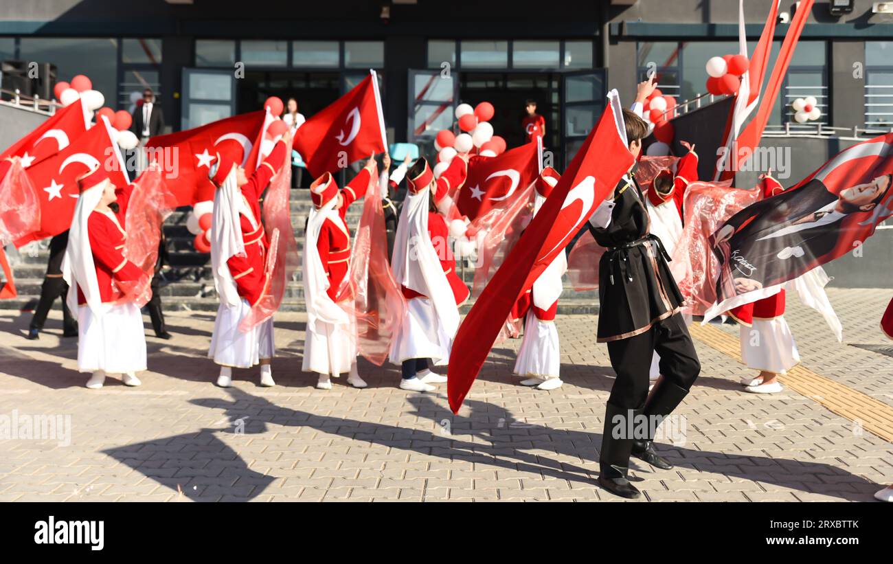 Bursa Turket - October 29 2022 : National Sovereignty and Children Day festival.Turkish children dancing in red and white traditional costumes. High q Stock Photo