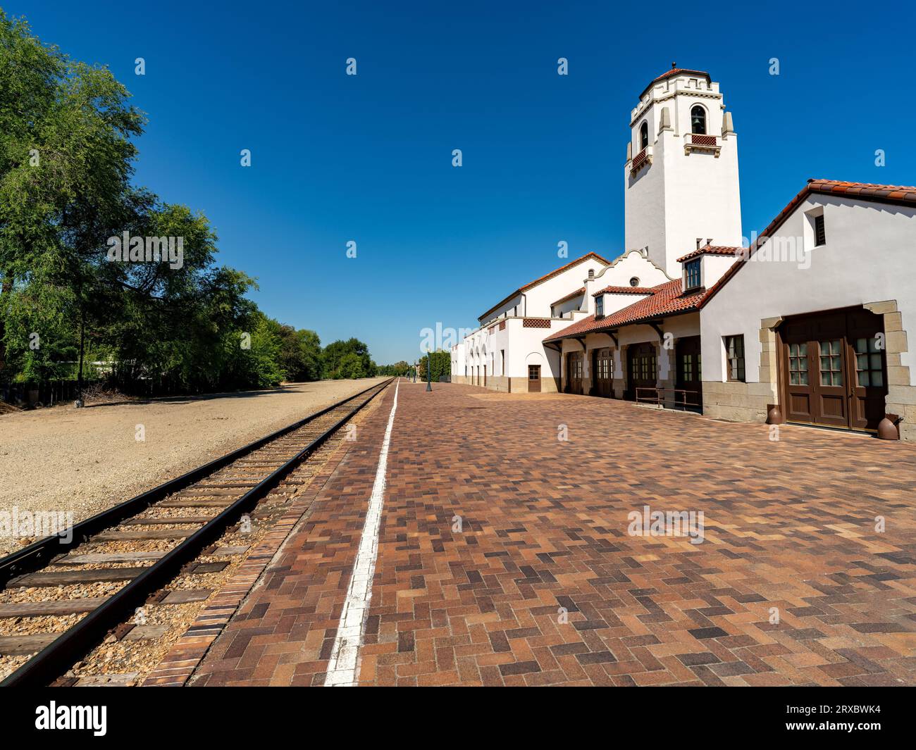 Cloudless blue sky over a railroad depot in Idaho Stock Photo