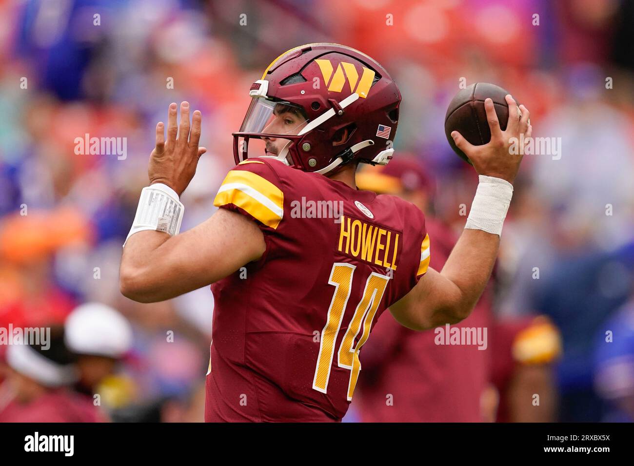 Washington Commanders quarterback Sam Howell (14) throwing the ball before  the start of an NFL football game against the Buffalo Bills, Sunday, Sept.  24, 2023, in Landover, Md. (AP Photo/Evan Vucci Stock