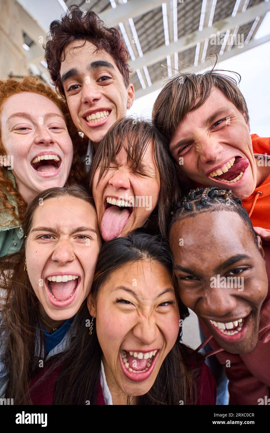 Selfie with friends. Friendly smiling teenagers making group photo