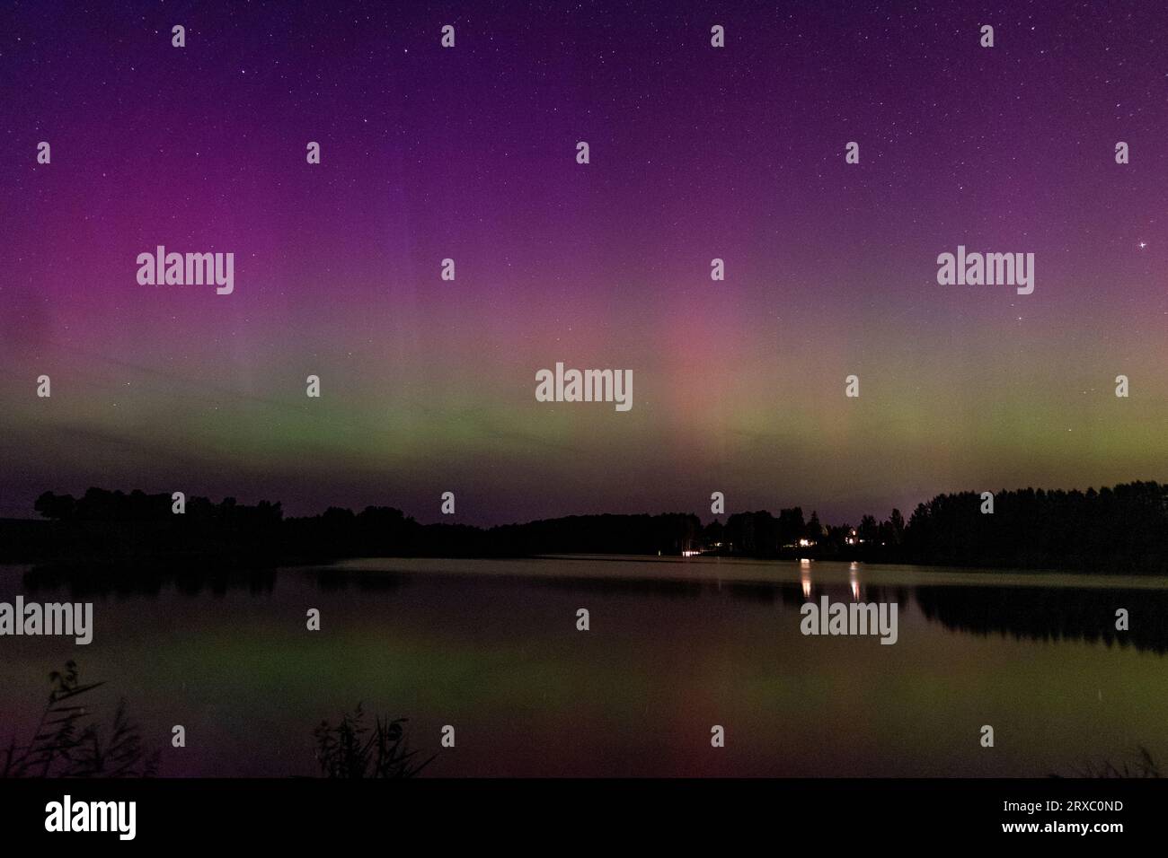 night image of a massive multicolored green vibrant Aurora Borealis