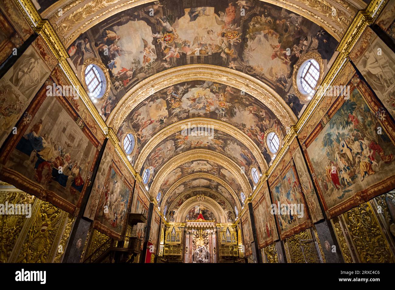 Valletta, Malta - 17 June 2023: Frescoed nave with altar in background in Valletta Cathedral, Malta Stock Photo