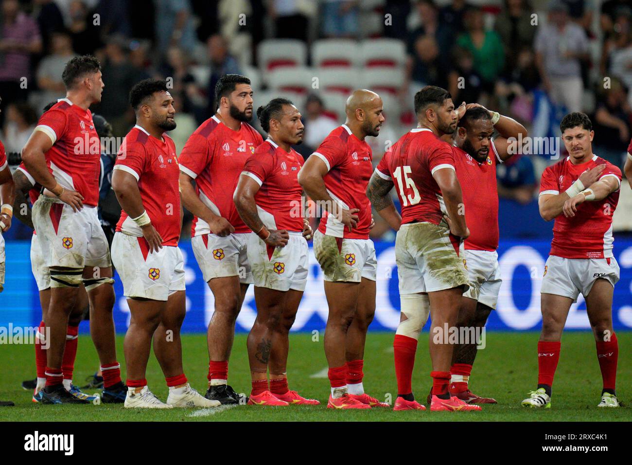 Tonga's players react at the end of the Rugby World Cup Pool B match ...