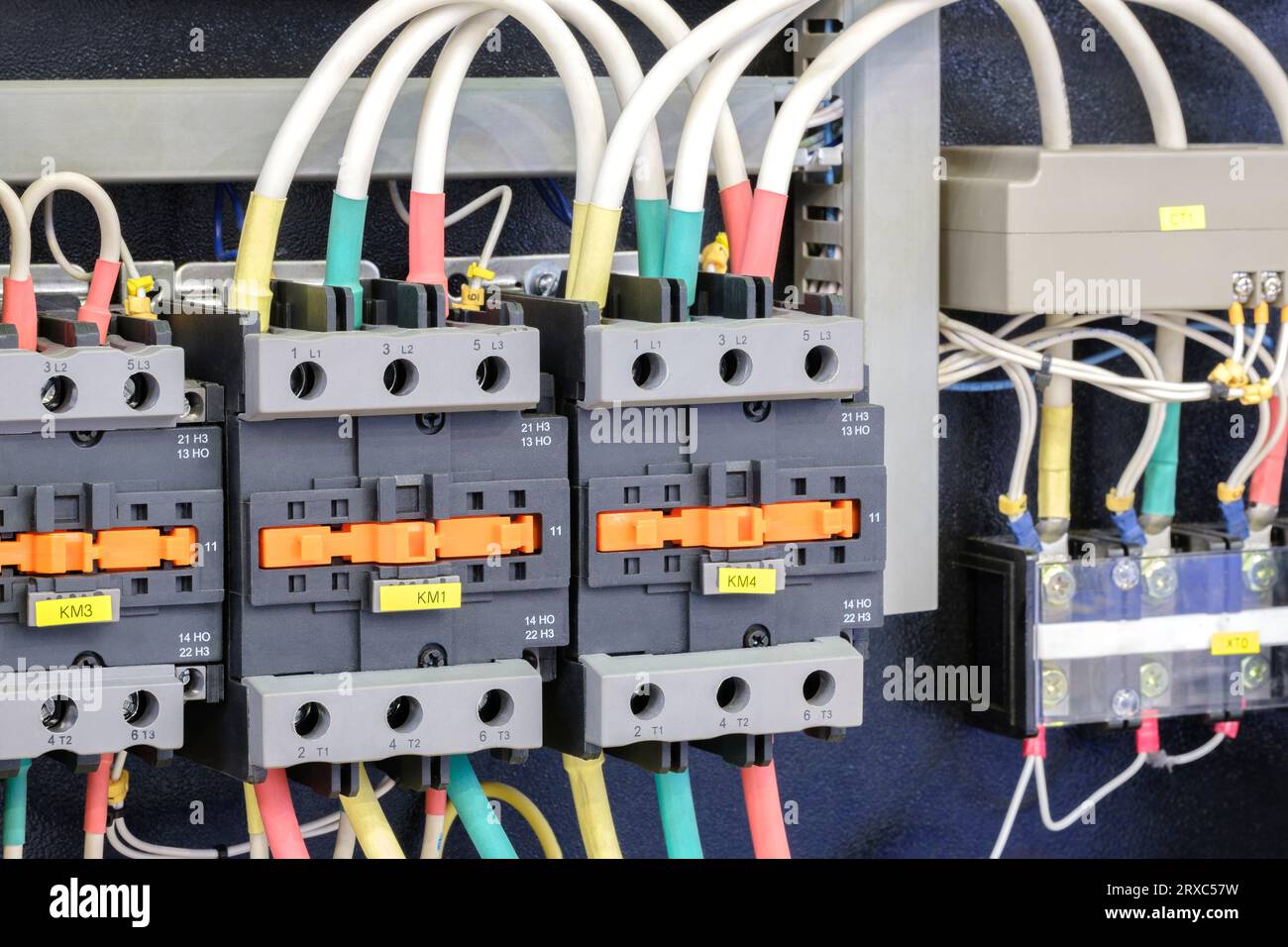 Close-up of Electricity distribution box with wires and circuit breakers in control room. Stock Photo