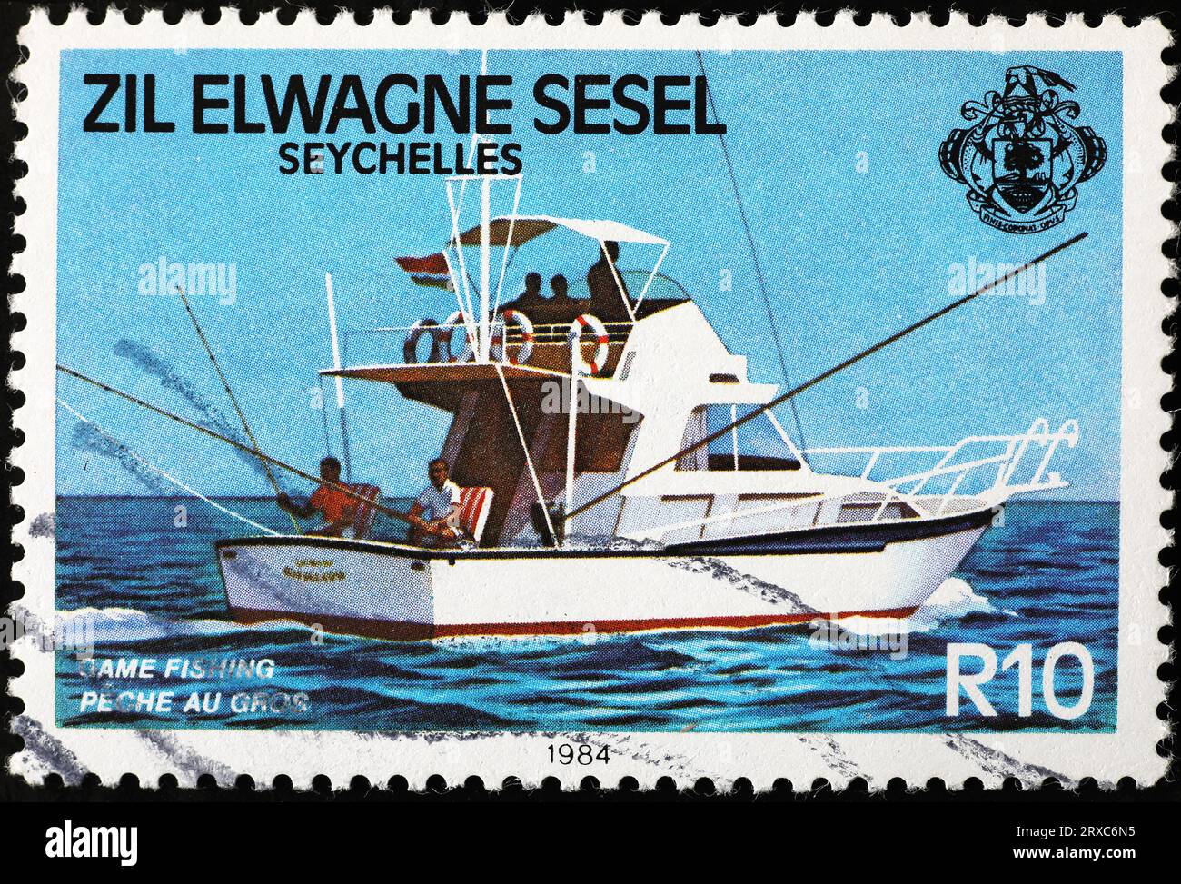 Game fishing celebration on postage stamp from Seychelles Stock Photo