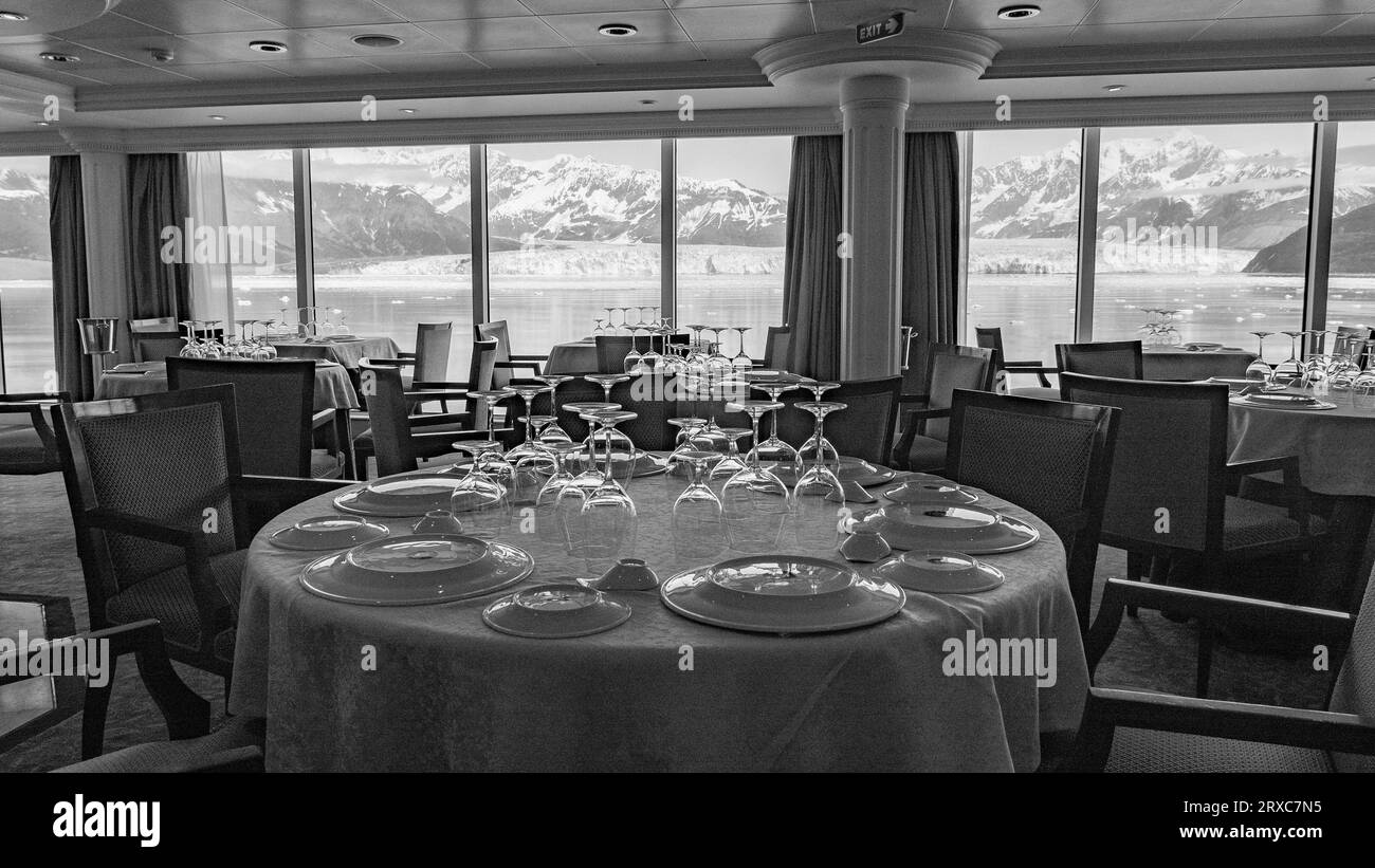 Hubbard Glacier luxury restaurant. Travel destination, no people. Empty restaurant seating interior with panoramic windows at scenic glacier bay natur Stock Photo