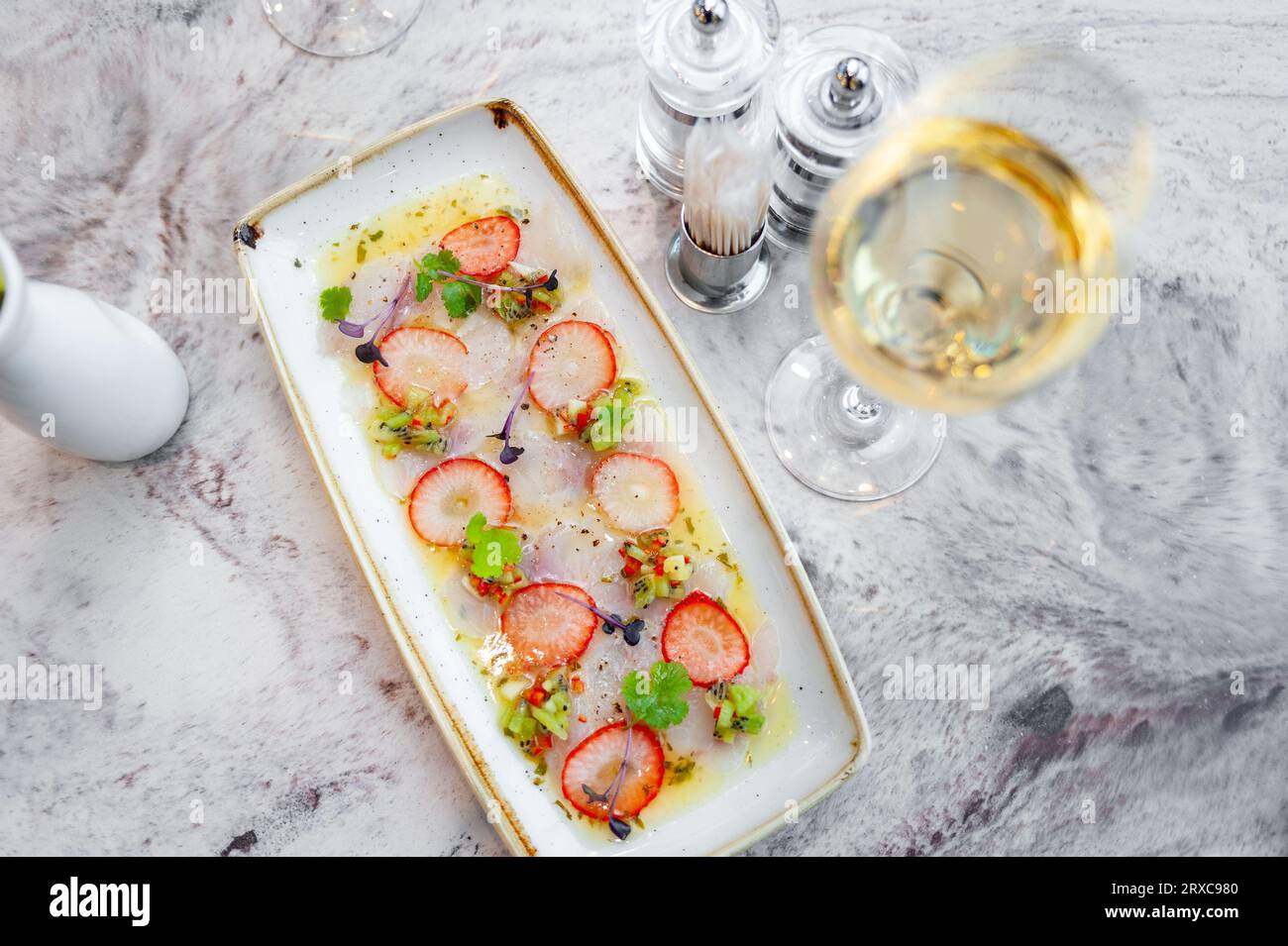 Sea bass ceviche with strawberry, kiwi and mango salsa Stock Photo Alamy
