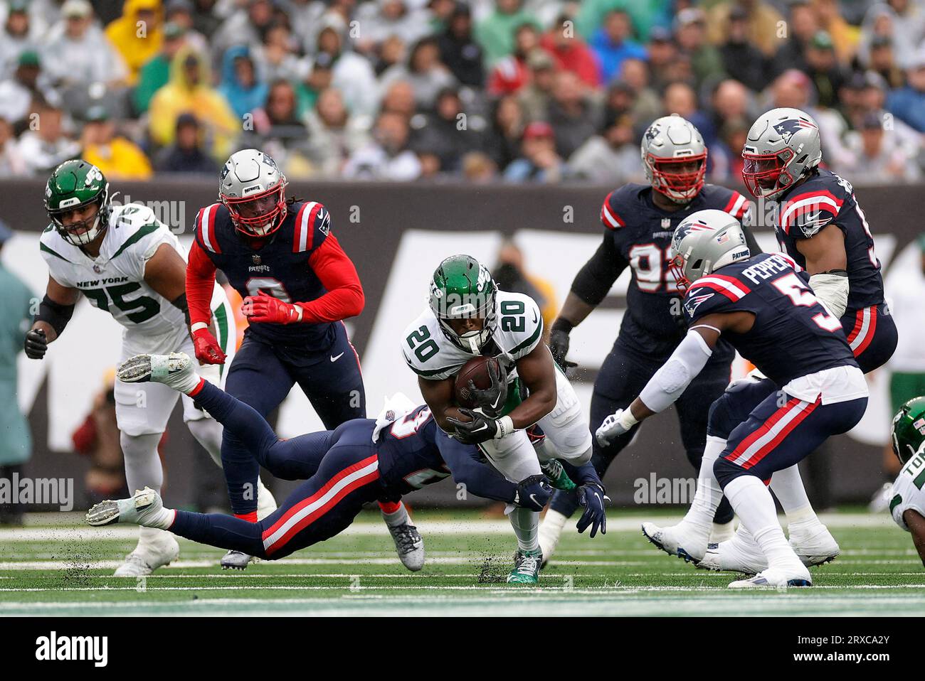 New York Jets Running Back Breece Hall (20) Is Tackled By The New ...