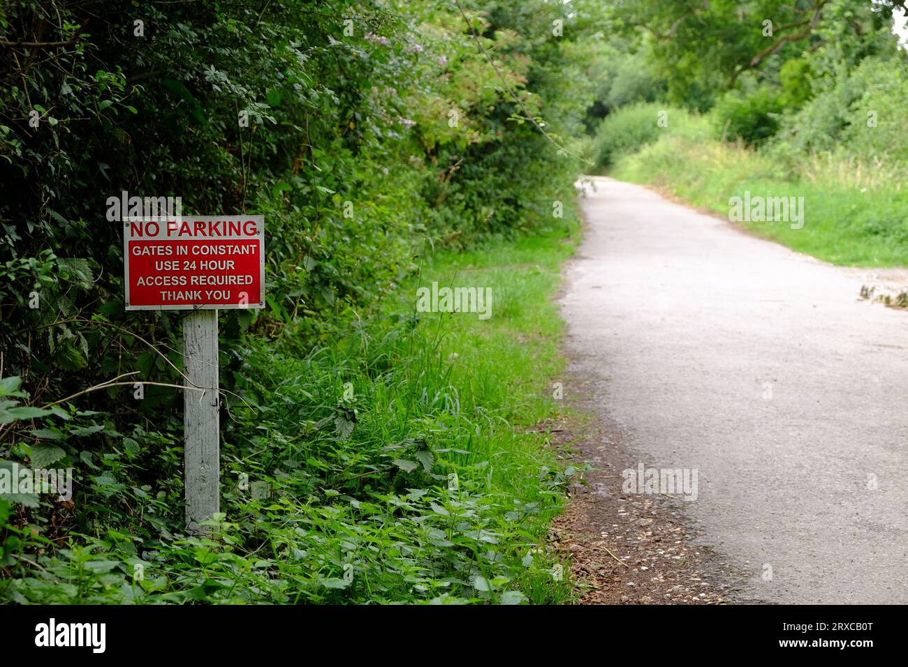July 2023 - No Parking sign in a country lane to allow access through gates opposite. Stock Photo