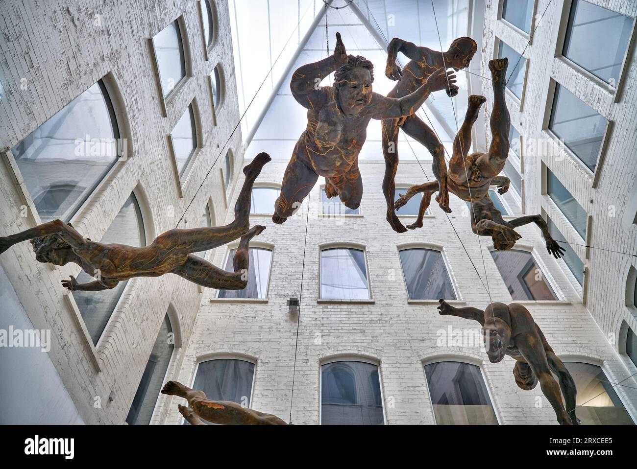 Hanging sculpture of falling figures called Deluge by Toin Adams at the Custard Factory, Digbeth