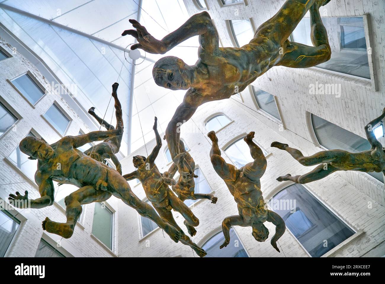 Hanging sculpture of falling figures called Deluge by Toin Adams at the Custard Factory, Digbeth