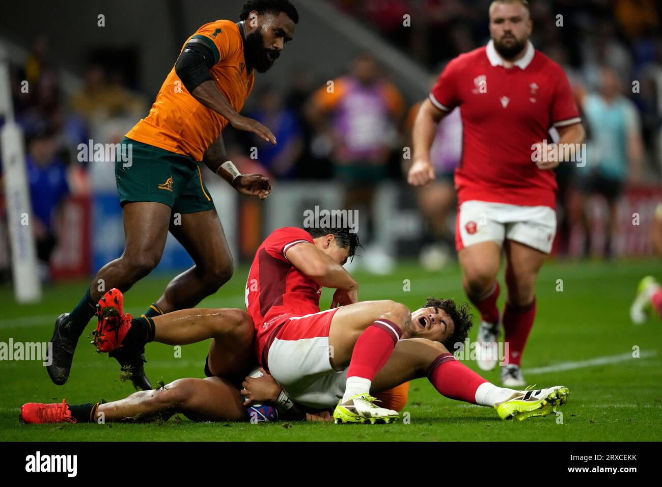 Jordan Rees Rugby Wales' Louis Rees-Zammit, center, challenges Australia's Jordan Petaia ...